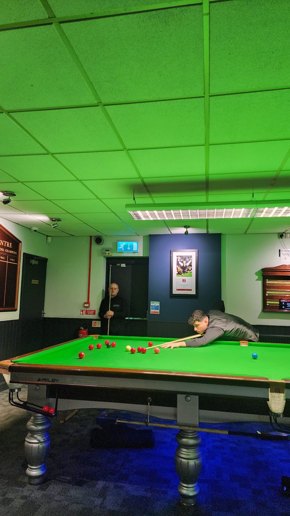 Yaron Bodor playing a shot during snooker competition
